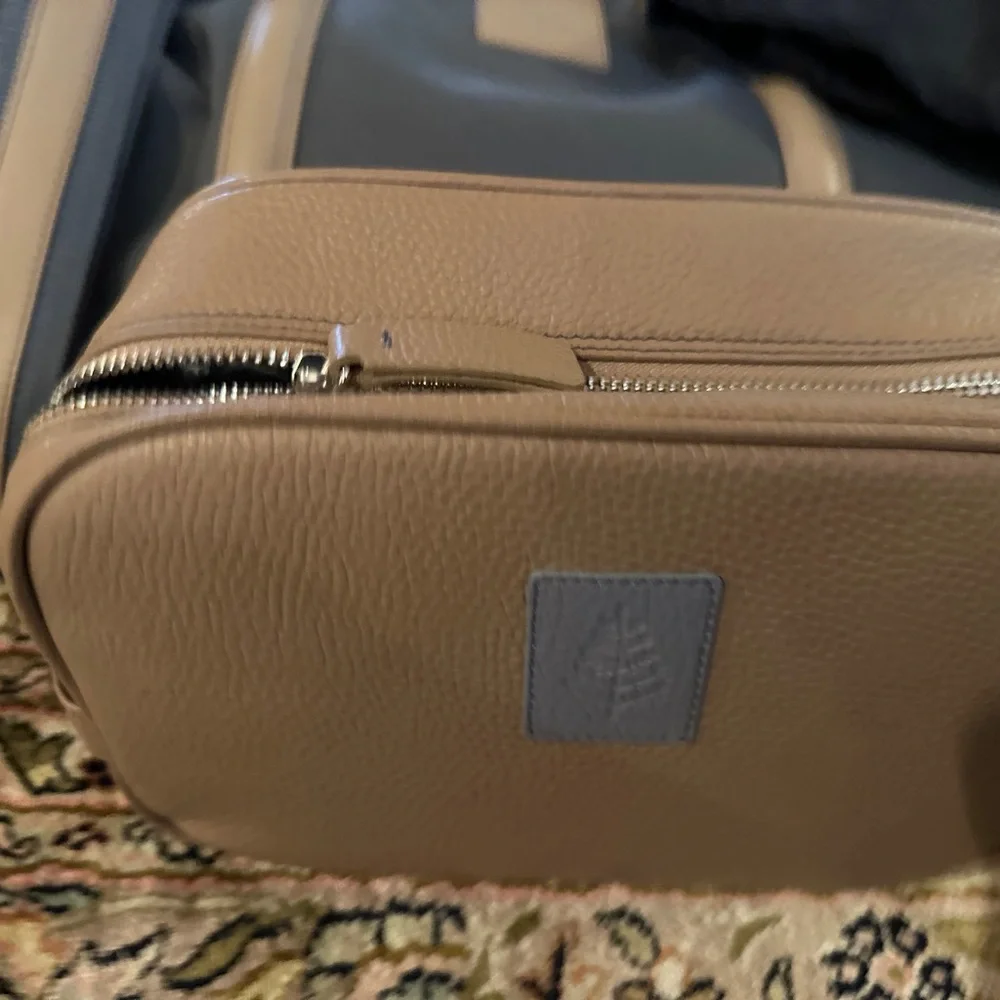 Exclusive Four seasons private jet experience duffel and toiletry kit.  BNWT